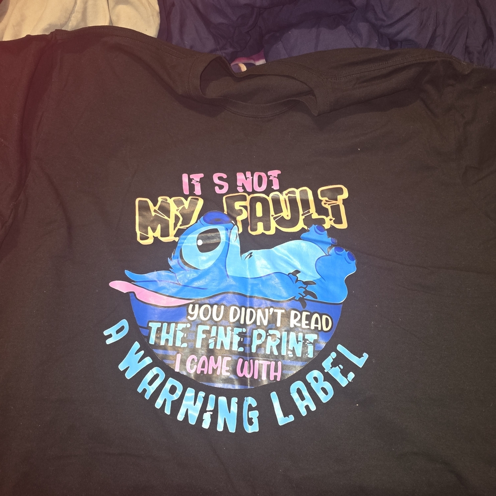 Black Graphic T-Shirt with Blue Cartoon Design